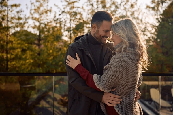 happy-couple-love-embracing-on-600nw-2553344997